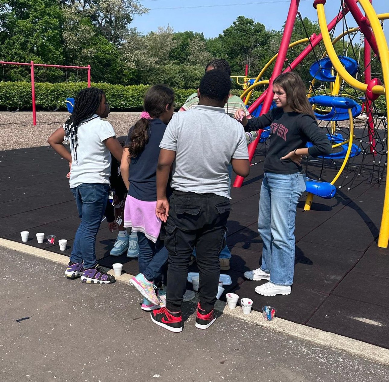 Tutors and students together on the playground