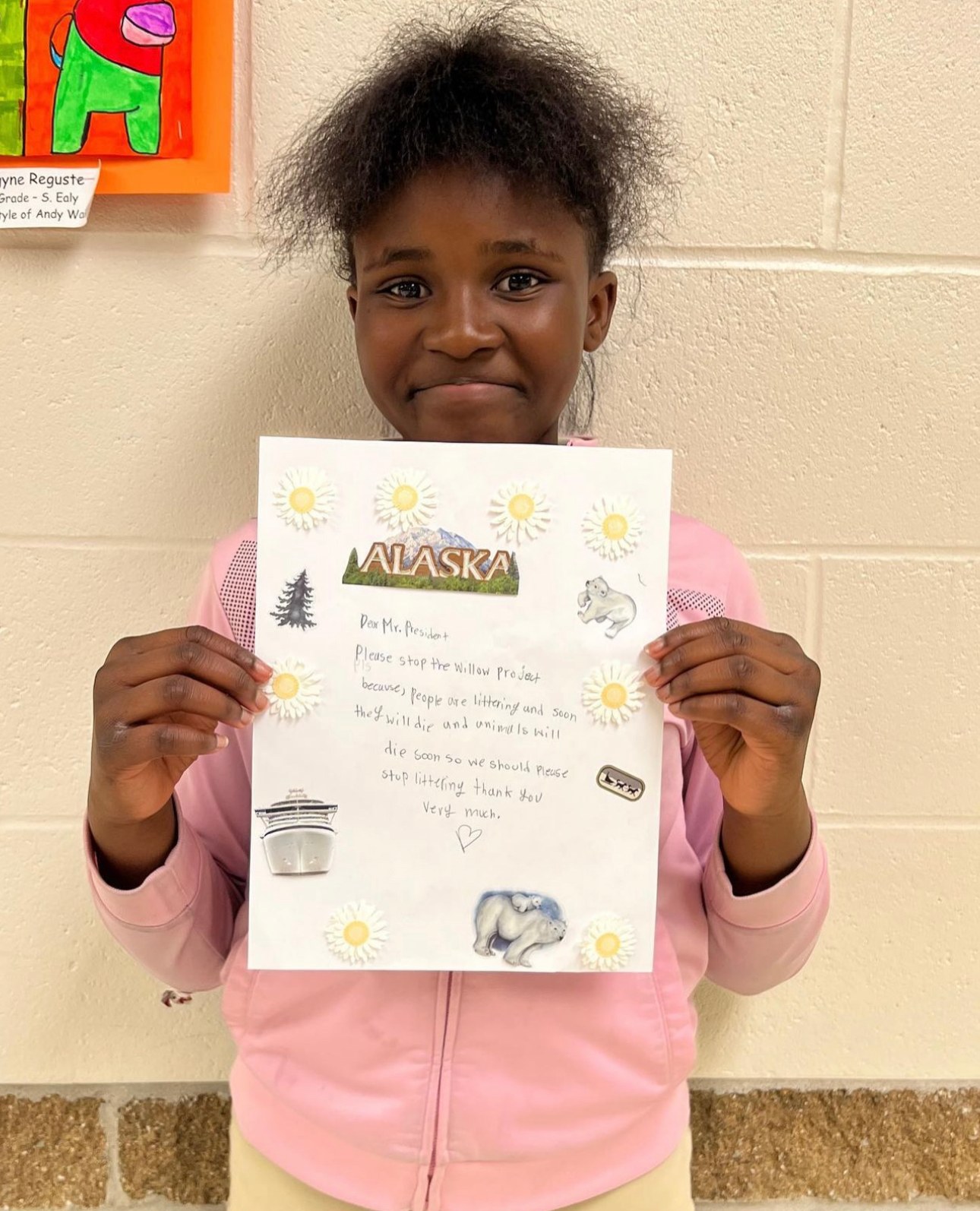 A student showing her completed writing page