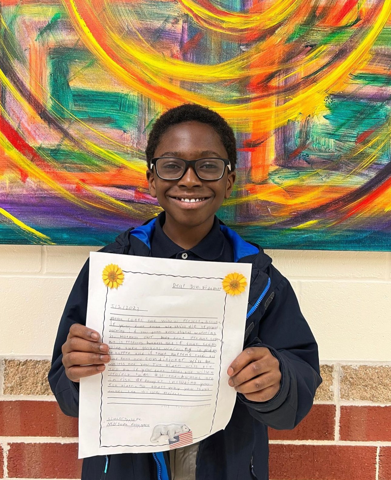 A student presenting his handwritten letter