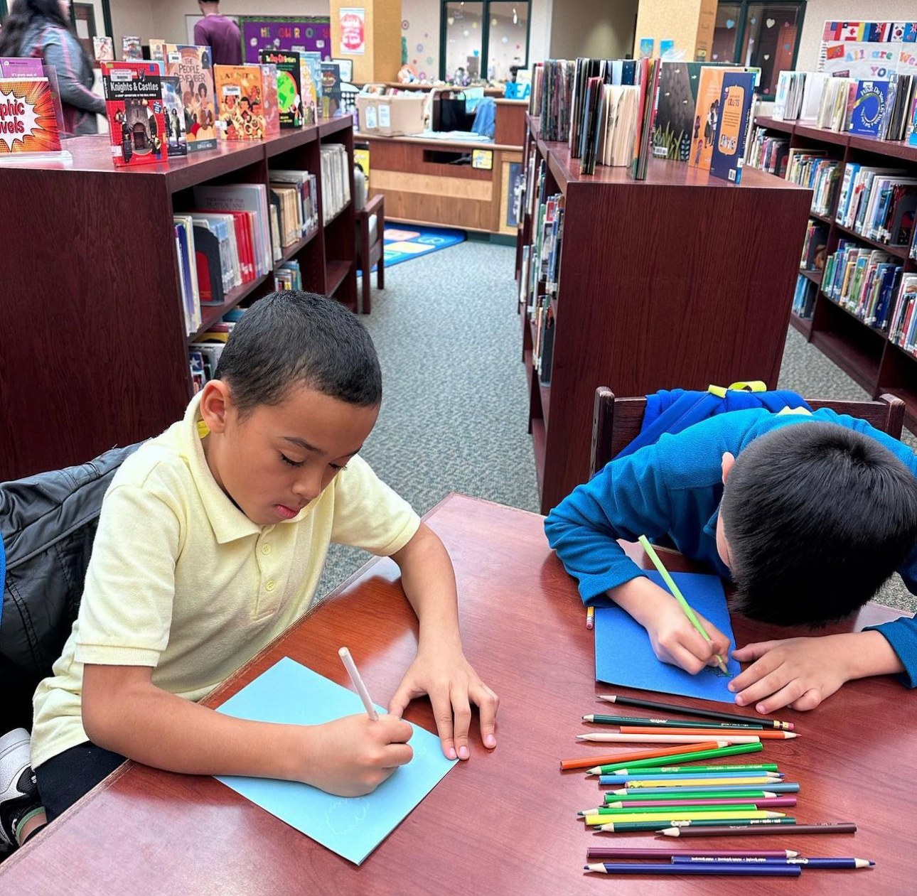 Two students working on a writing exercise